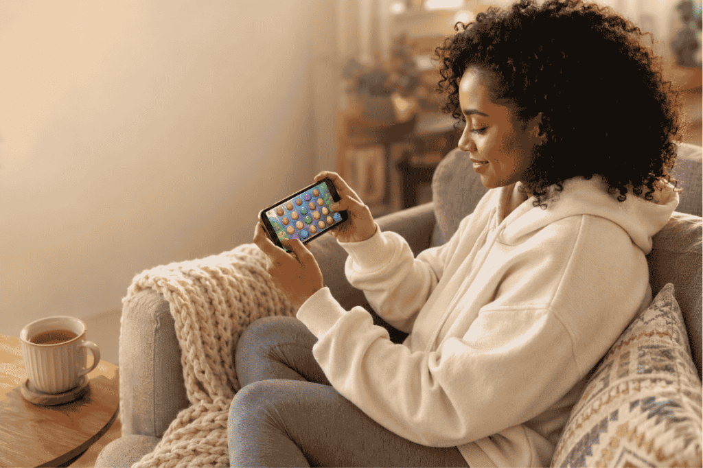 Games like Project Makeover shown as merge and match-3 makeover titles on a phone screen